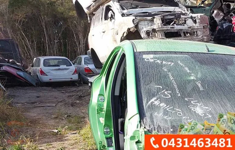 Auto wreckers dismantling a car in Adelaide